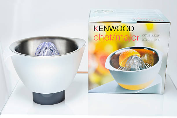 Dieulefit, France - September 4, 2011: The Kenwood citrus juicer attachment  AT960 and the box in which it comes. It is compatible with the Kenwood Chef and Kenwood Major food mixers. The Kenwood citrus juicer attachment attaches to your food mixer, an accessory for extracting juice from citrus fruit. The Kenwood Chef, first available in 1950, is the most famous product of the Kenwood Company. The name Kenwood came from the founder of the original company, Kenneth Maynard Wood.